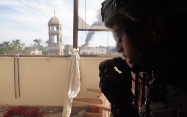 Gaza skyline with Israeli soldier in foreground IDF photo