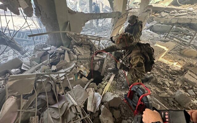 IDF troops inspect tunnel entrance near Gaza school IDF photo